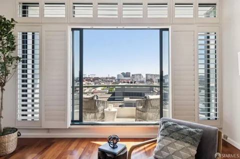 a view of a balcony with chairs