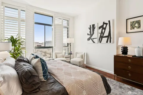 a bedroom with a bed and a couch