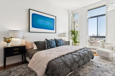 a bedroom with a bed and a couch