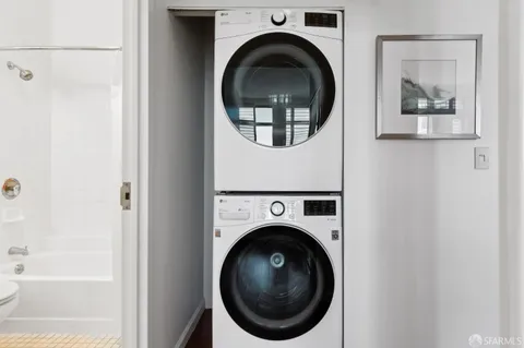 a view of a hallway with washer and dryer