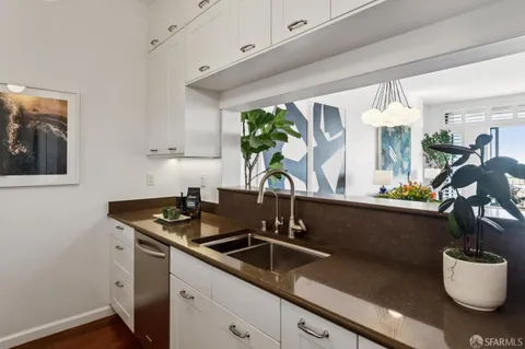 a kitchen with a sink and a stove