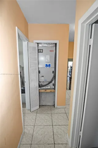 a room with a refrigerator and washer
