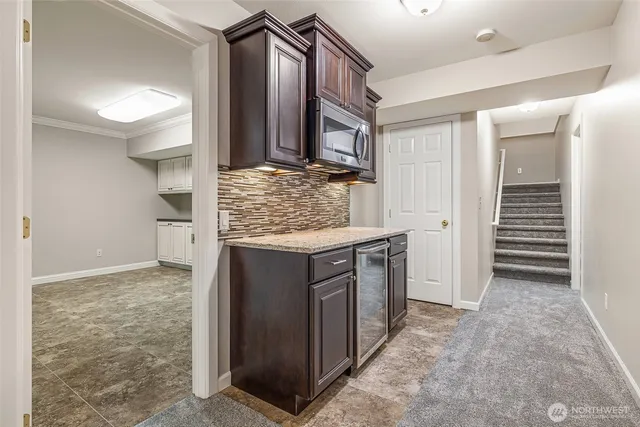a view of hallway with cabinets
