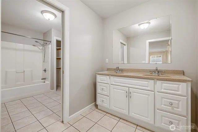 a bathroom with a granite countertop sink mirror and