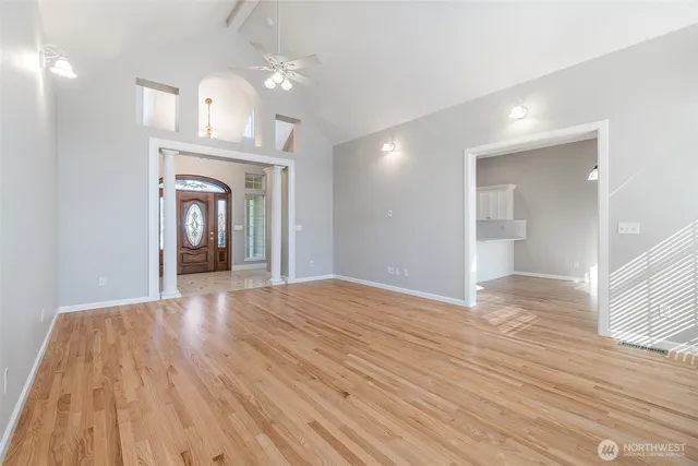 a view of livingroom with hardwood floor and a ceiling fan