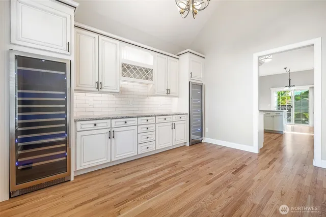 a kitchen with stainless steel appliances granite countertop a stove and a refrigerator