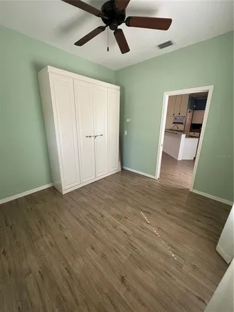 a view of an empty room and a window