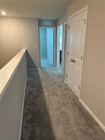 a view of hallway with closet