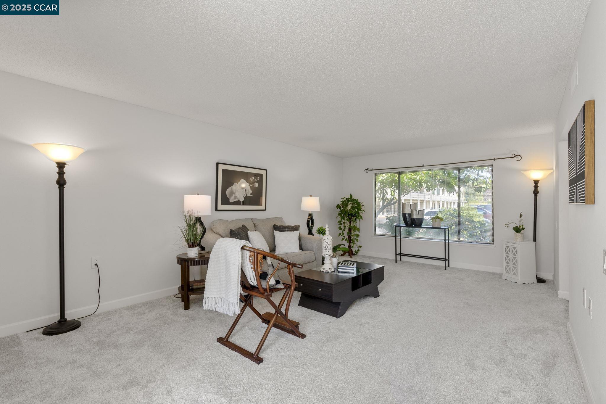 2017 Pine Knoll Drive, Unit 4 Walnut Creek, CA 94595 - Photo 21 of 21 a living room with furniture and a large window