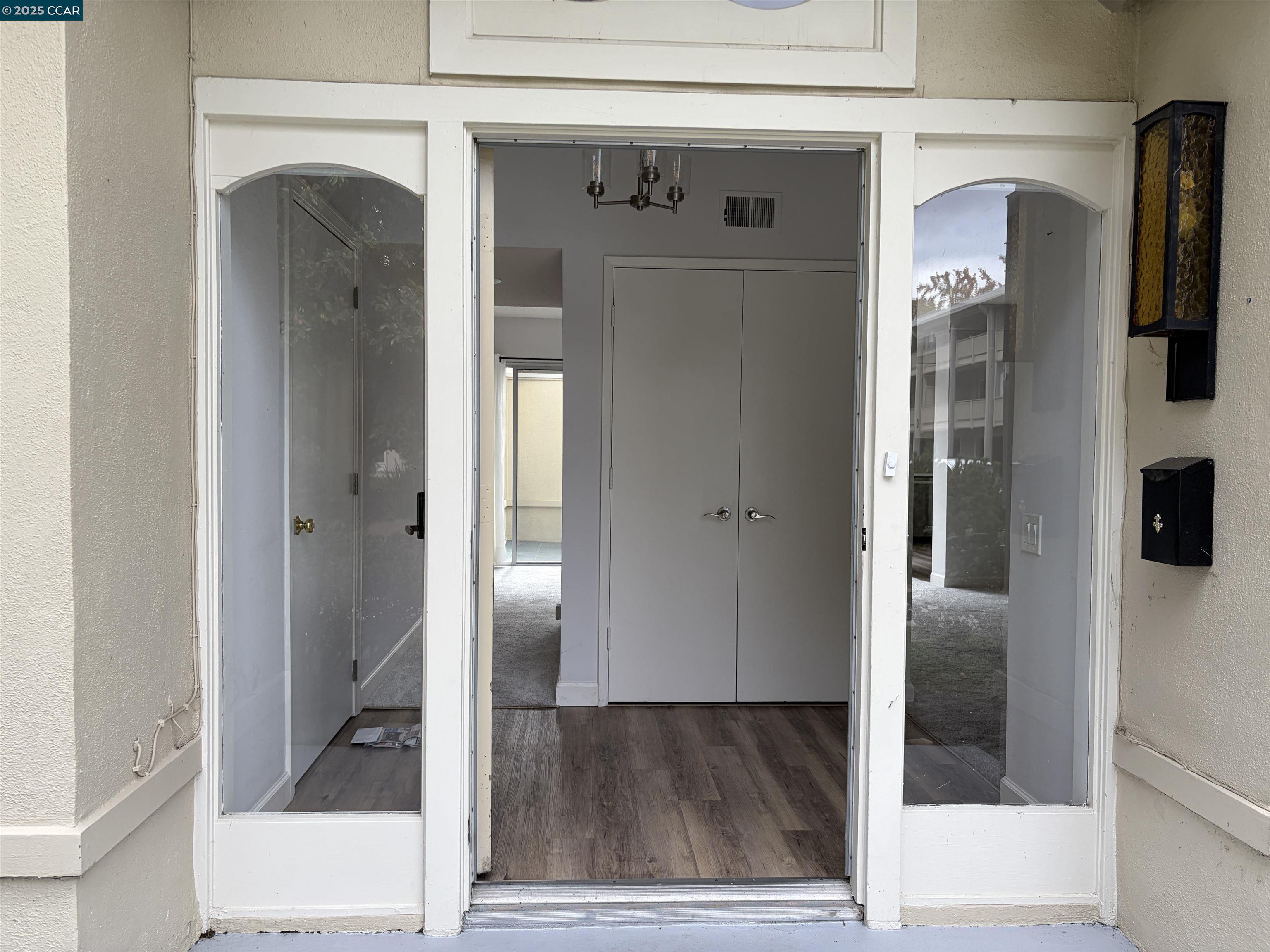 2017 Pine Knoll Drive, Unit 4 Walnut Creek, CA 94595 - Photo 3 of 21 a view of a hallway with wooden floor and staircase