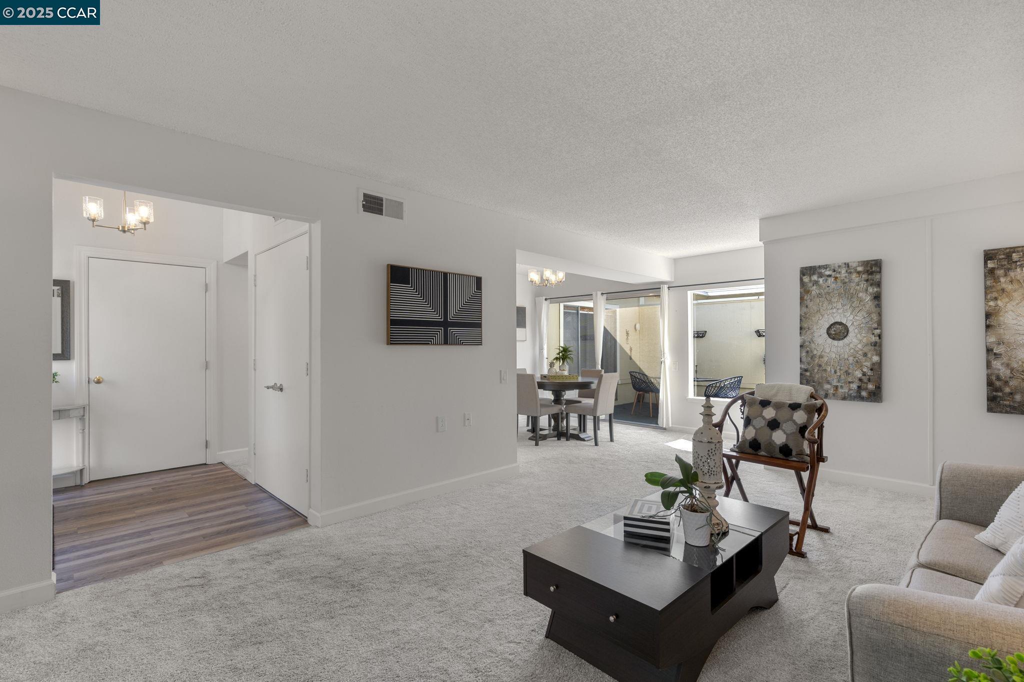 2017 Pine Knoll Drive, Unit 4 Walnut Creek, CA 94595 - Photo 7 of 21 a living room with furniture and a flat screen tv