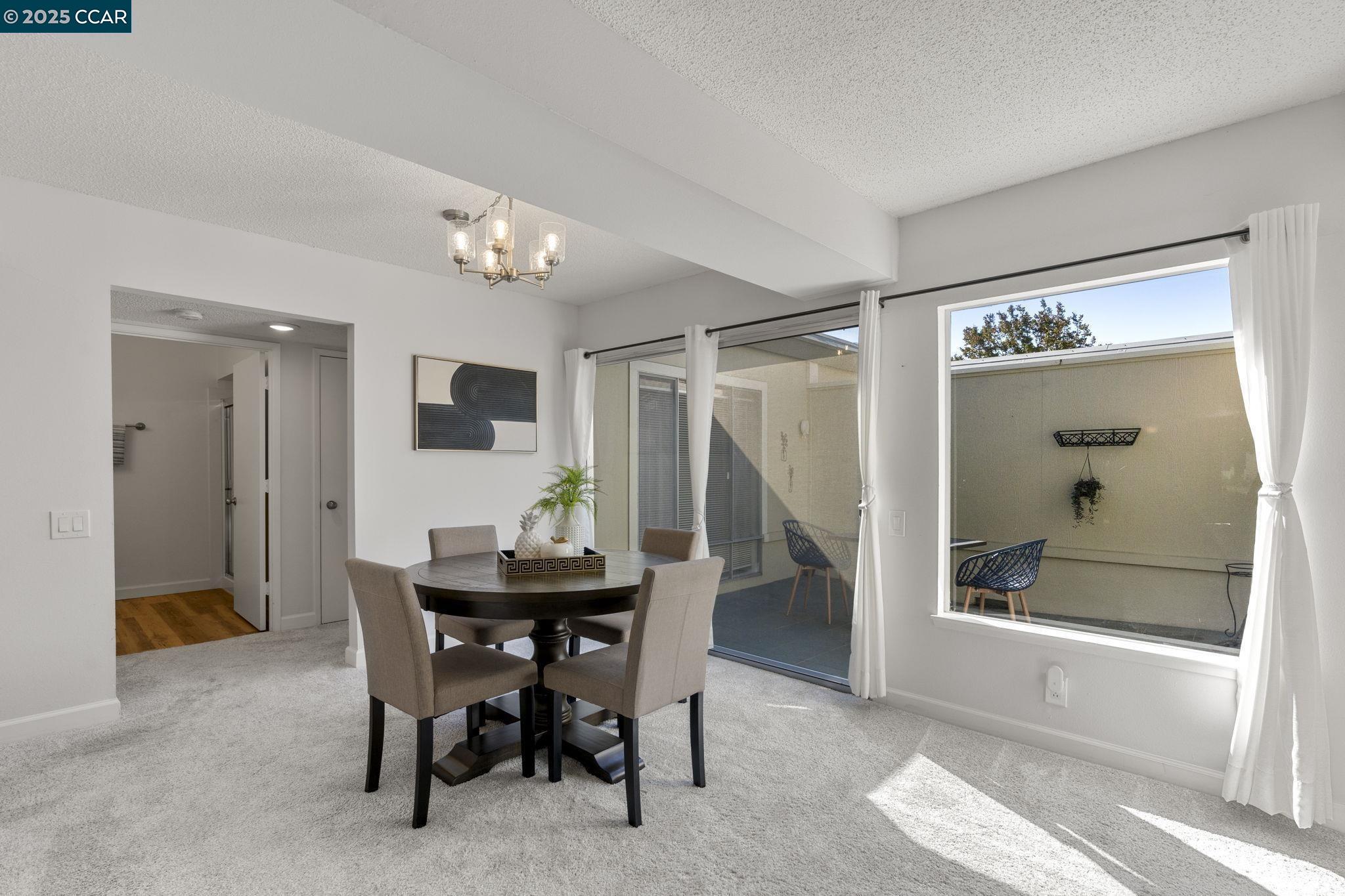 2017 Pine Knoll Drive, Unit 4 Walnut Creek, CA 94595 - Photo 8 of 21 a view of a dining room with furniture