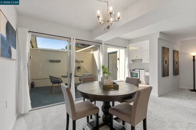 a view of a dining room with furniture and window