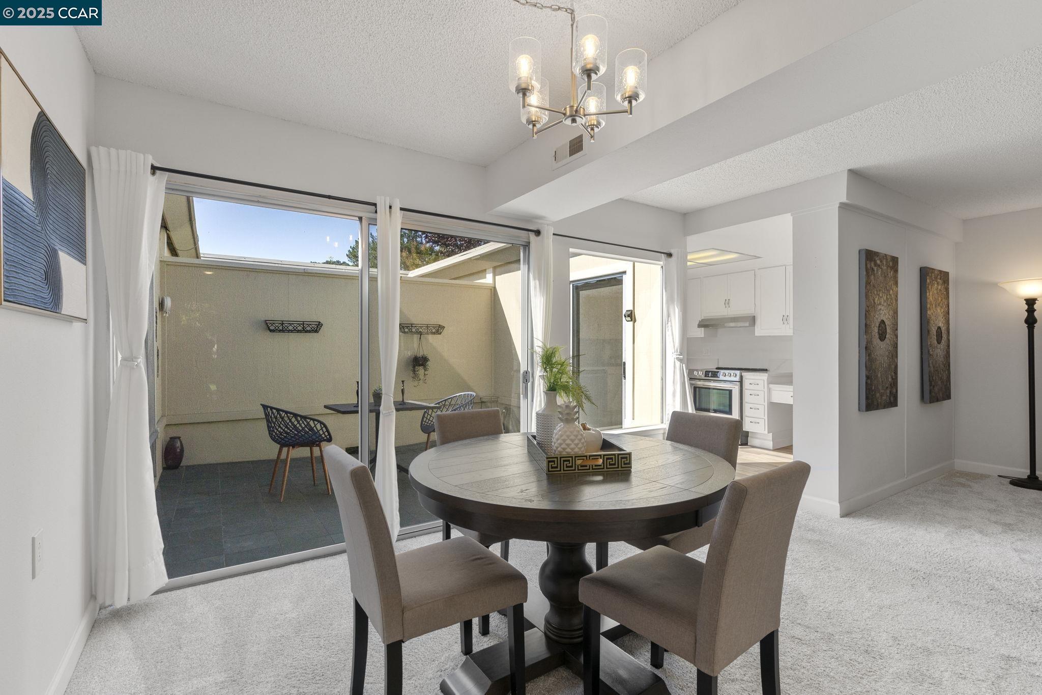 2017 Pine Knoll Drive, Unit 4 Walnut Creek, CA 94595 - Photo 9 of 21 a view of a dining room with furniture and window