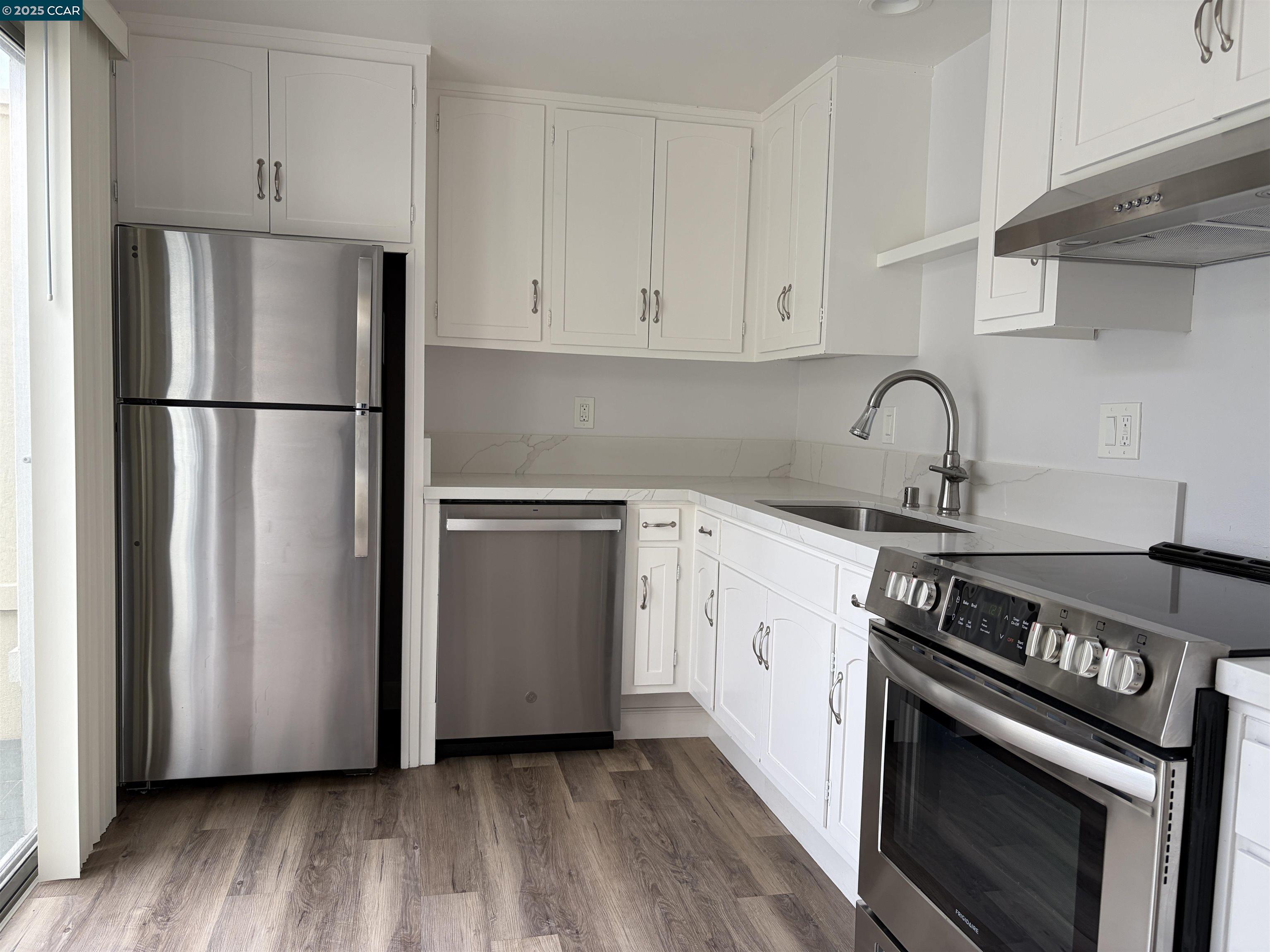 2017 Pine Knoll Drive, Unit 4 Walnut Creek, CA 94595 - Photo 10 of 21 a kitchen with a stove refrigerator and sink