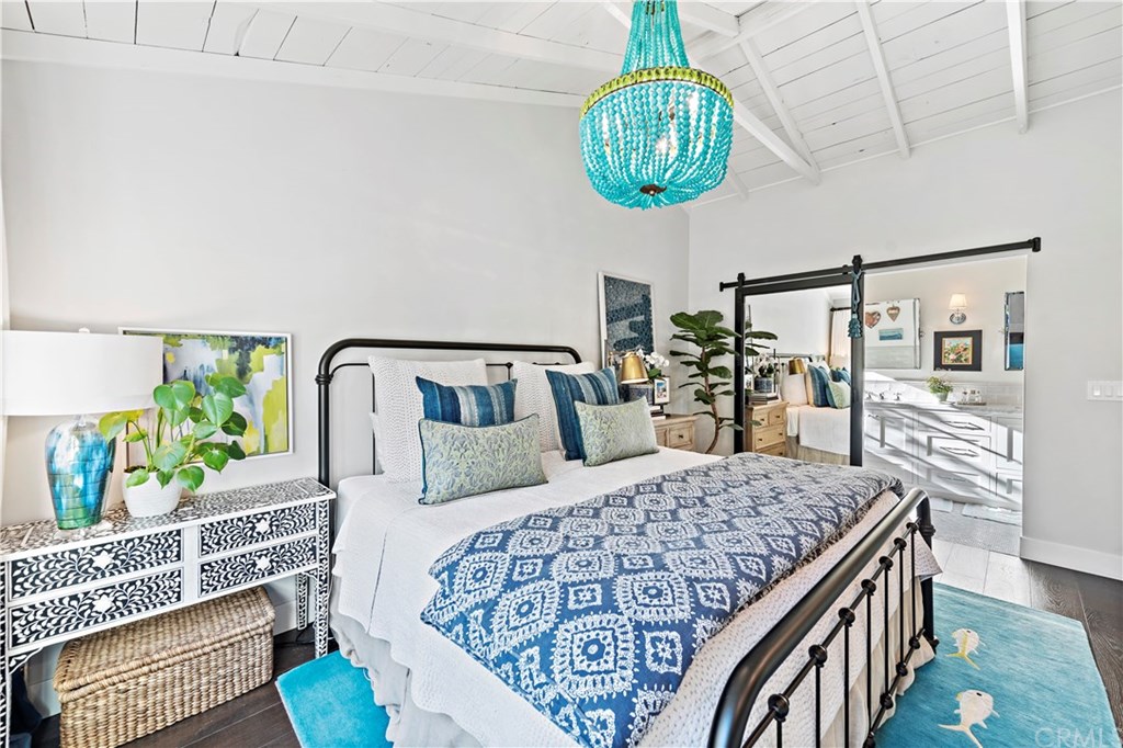 464 El Bosque Laguna Beach, CA 92651 - Photo 12 of 25 Master bedroom with sliding mirrored farmhouse door to the master bathroom.