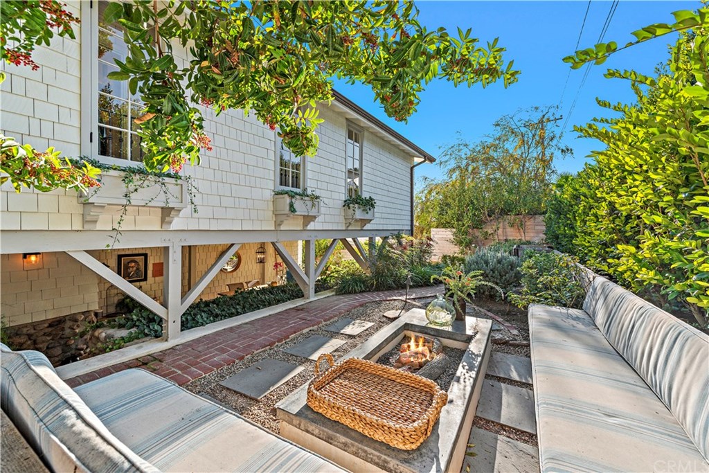 464 El Bosque Laguna Beach, CA 92651 - Photo 21 of 25 Rear yard with built in firepit and seating.