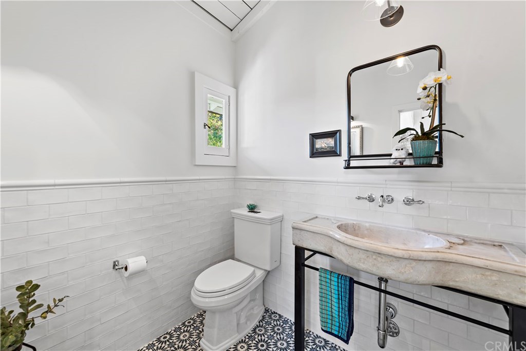 464 El Bosque Laguna Beach, CA 92651 - Photo 10 of 25 Half-bath with antique French sink.