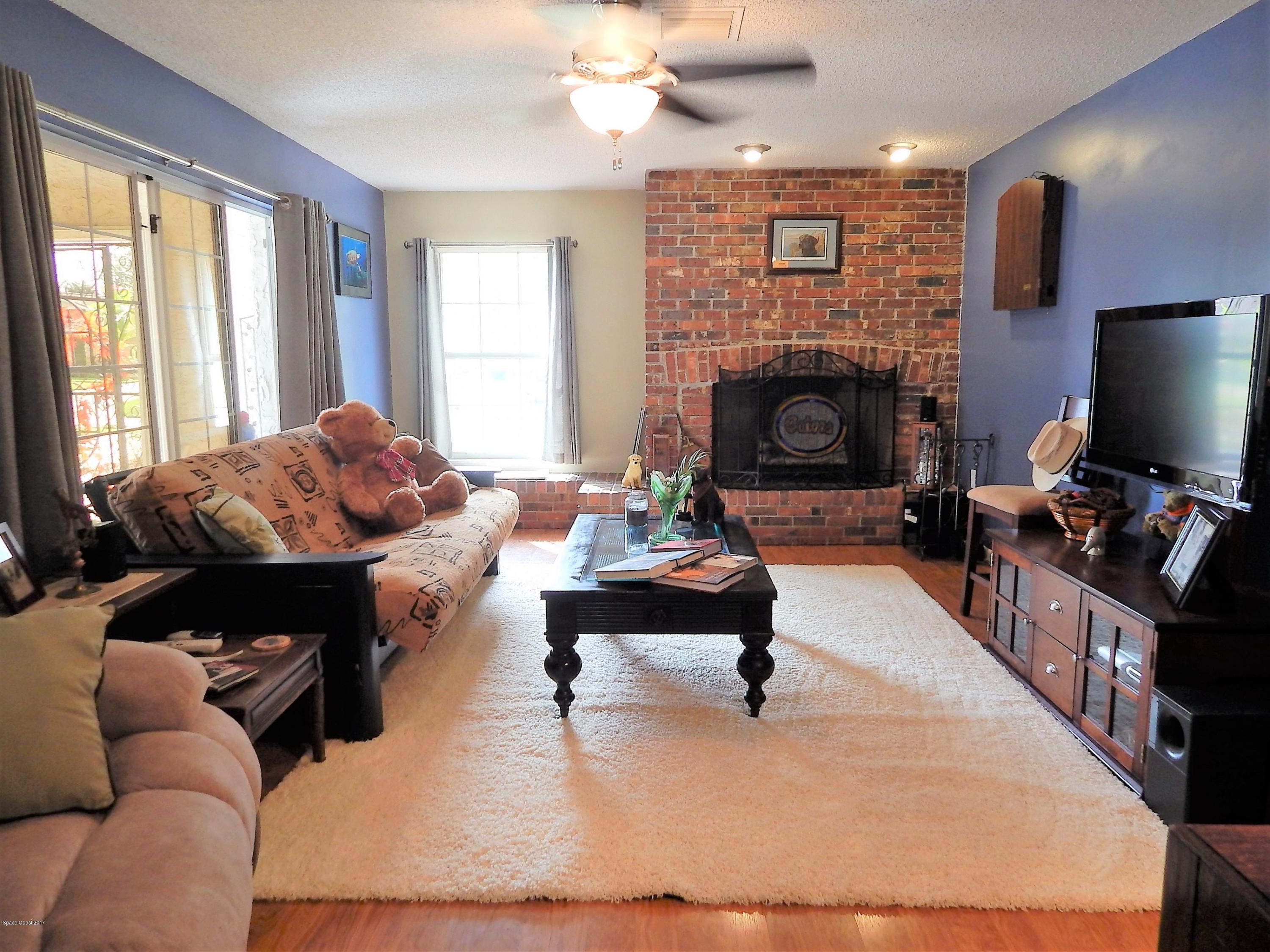 1190 St George Road Merritt Island, FL 32952 - Photo 4 of 29 Living Room with Fireplace