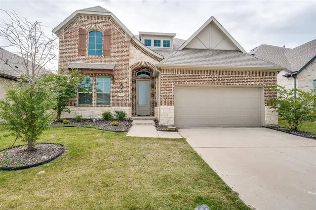 a view of a house with garden and yard