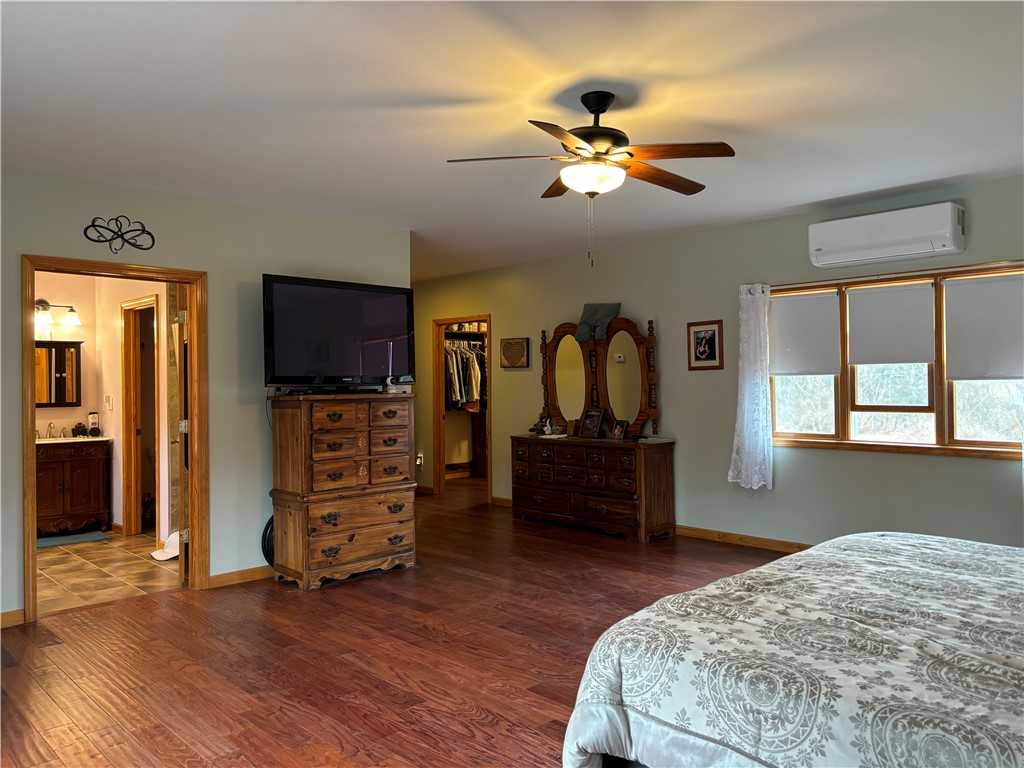 172 Hawks Road Pittsfield, NY 13411 - Photo 13 of 45 Primary bedroom showing walk in closet and attache