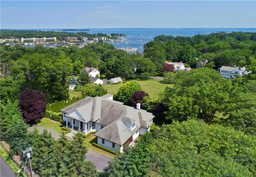 an aerial view of a house with yard and outdoor seating