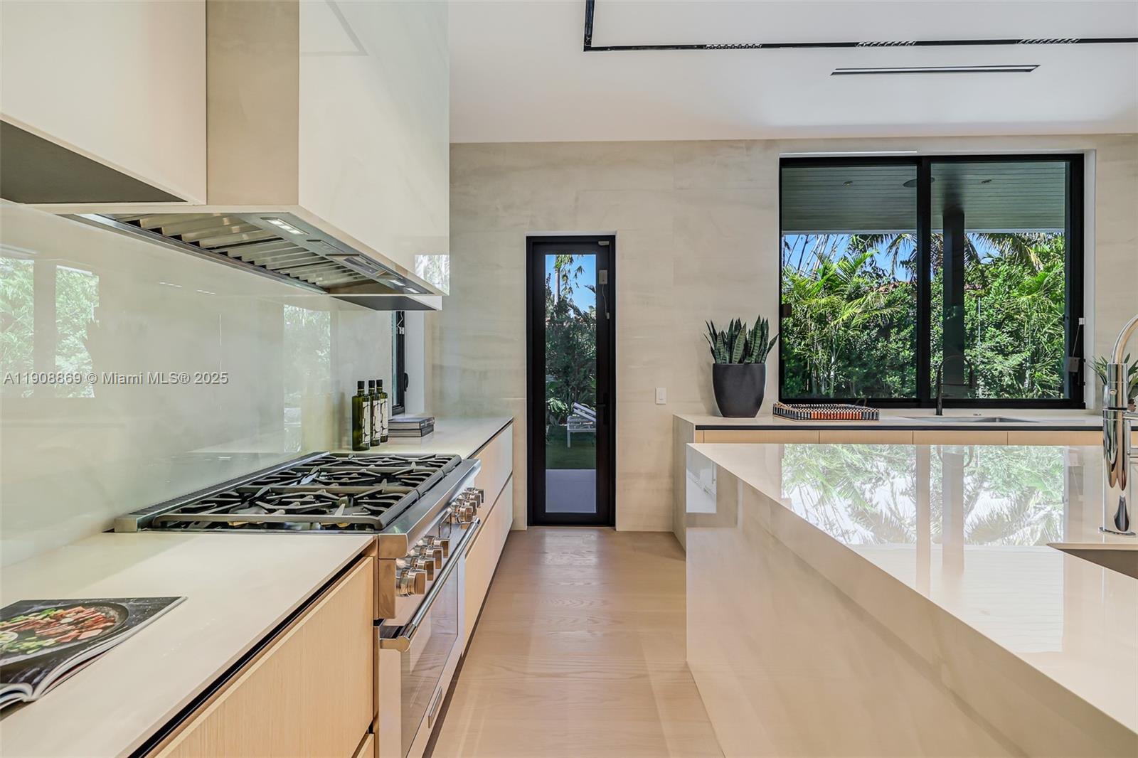 1661 Onaway Drive Miami, FL 33133 - Photo 11 of 26 a kitchen with stove and cabinets