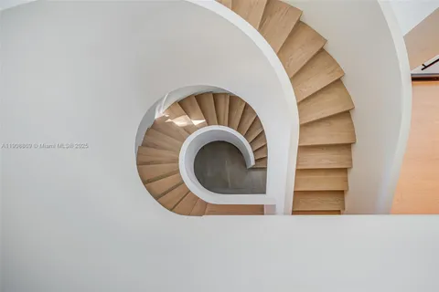 a spacious bedroom with a large bed and windows