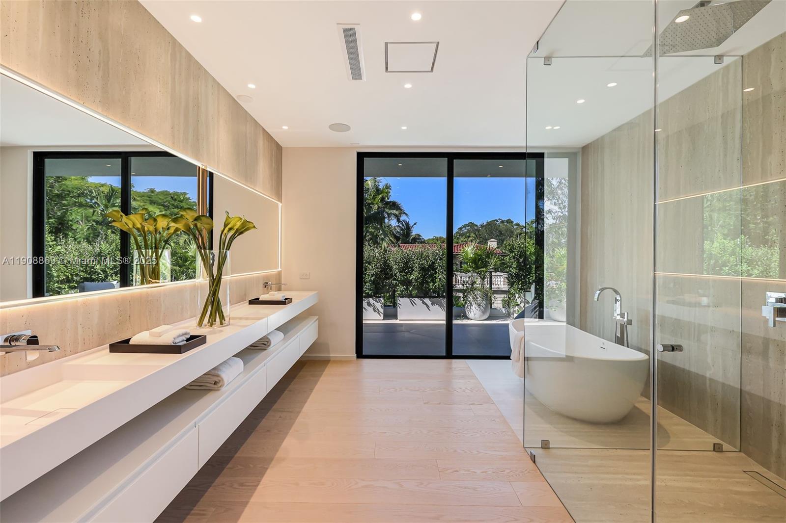 1661 Onaway Drive Miami, FL 33133 - Photo 15 of 26 a bathroom with a large tub and shower