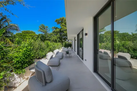 a view of livingroom with furniture and garden