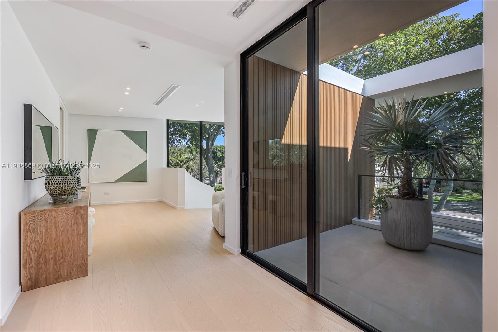 1661 Onaway Drive Miami, FL 33133 - Photo 19 of 26 a view of livingroom with furniture and garden