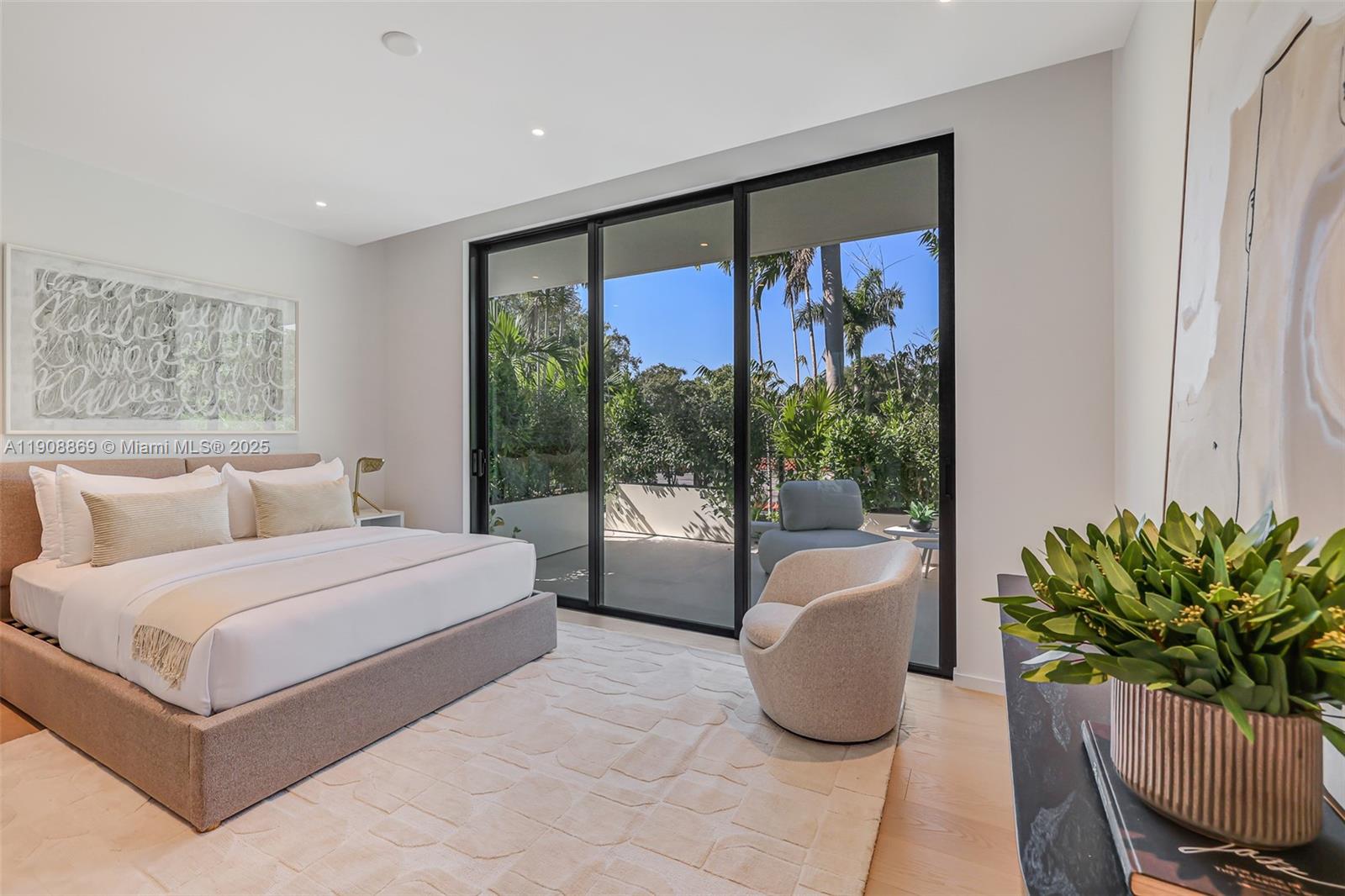 1661 Onaway Drive Miami, FL 33133 - Photo 20 of 26 a bedroom with a large bed and a potted plant