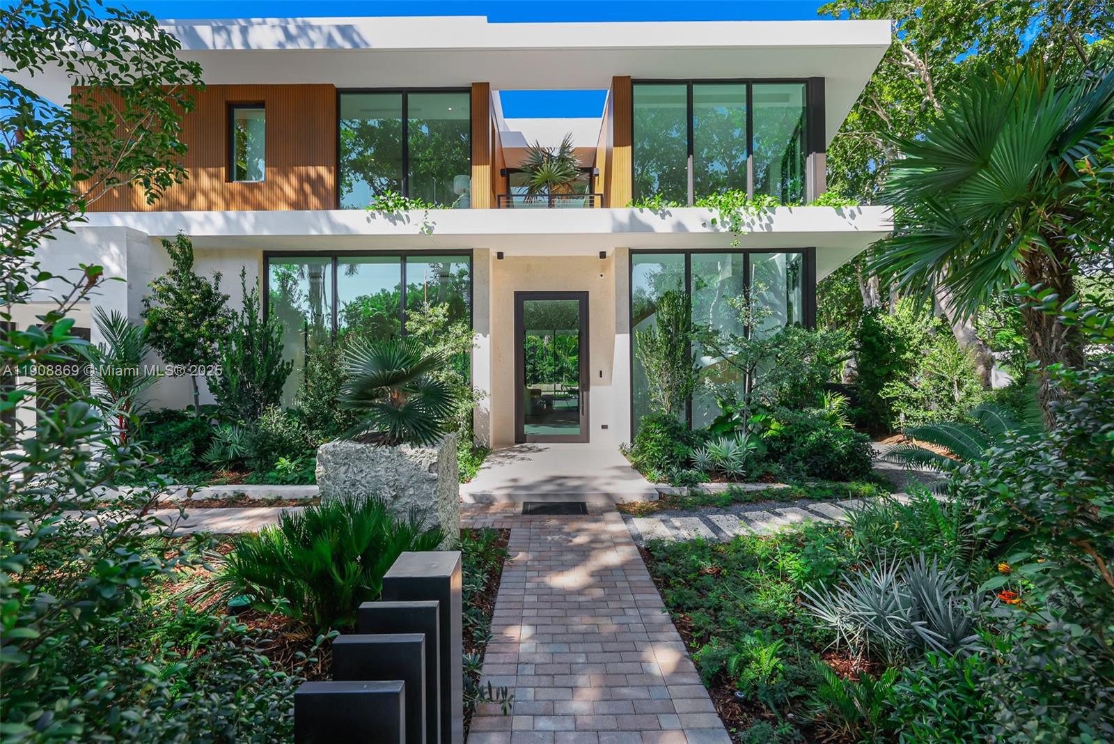 1661 Onaway Drive Miami, FL 33133 - Photo 2 of 26 a front view of a house with a porch
