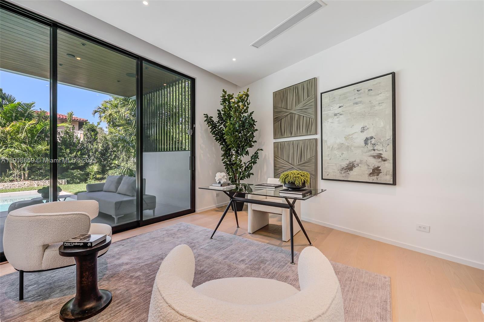 1661 Onaway Drive Miami, FL 33133 - Photo 23 of 26 a living room with furniture and a potted plant