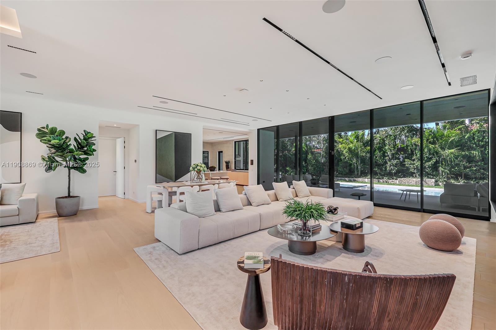 1661 Onaway Drive Miami, FL 33133 - Photo 6 of 26 a living room with furniture and a large window