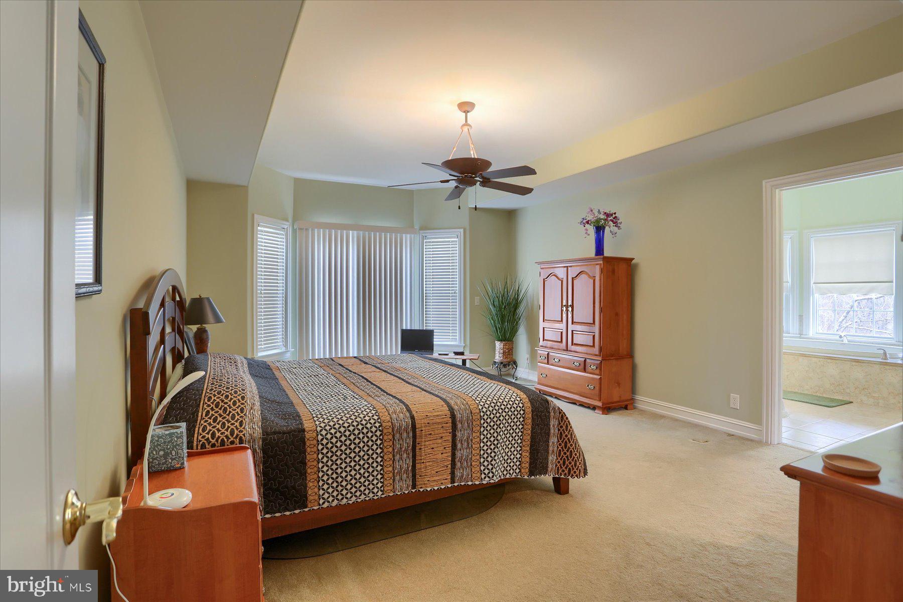 210 South Grantham Road Dillsburg, PA 17019 - Photo 27 of 56 a bedroom with a bed and a chandelier