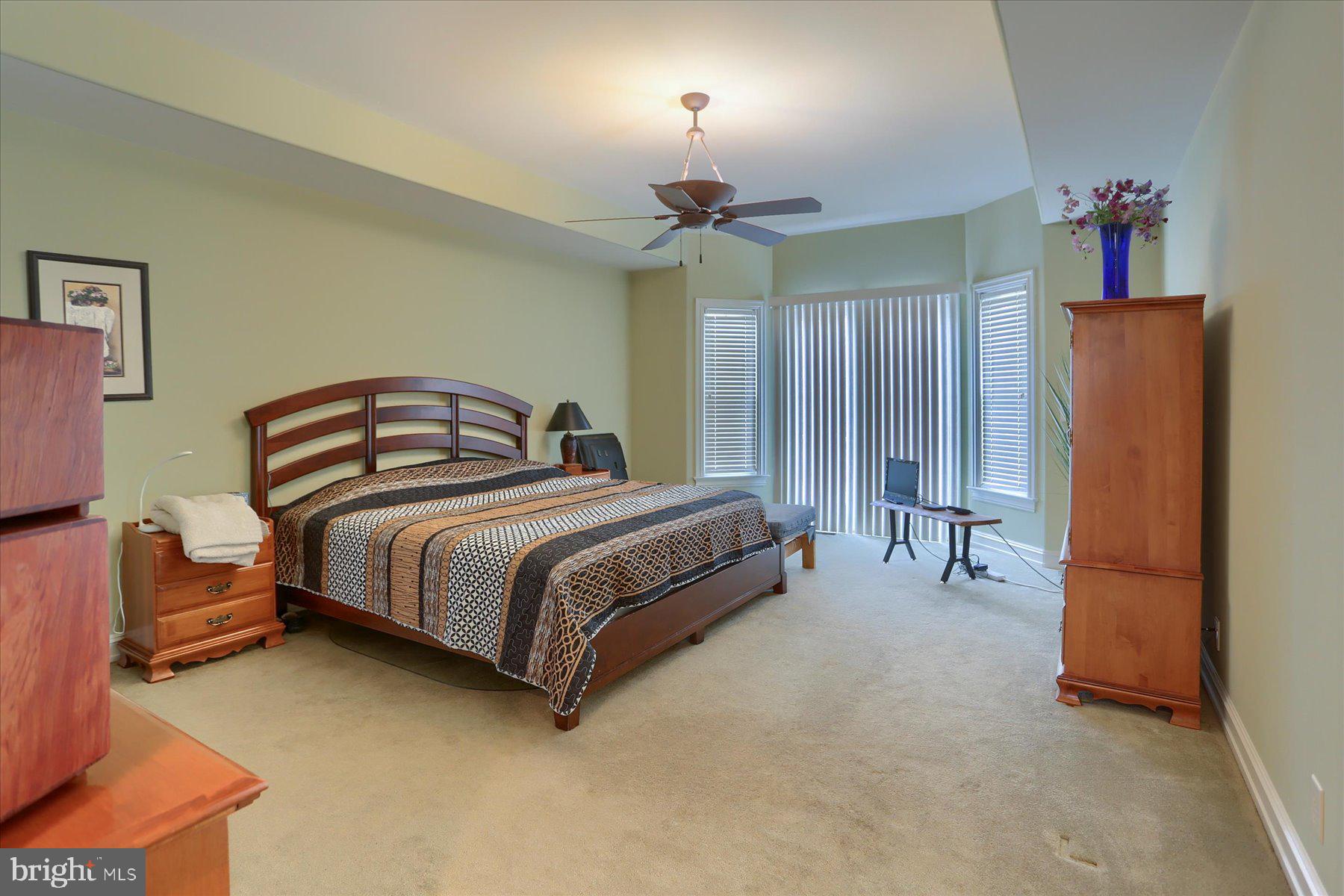 210 South Grantham Road Dillsburg, PA 17019 - Photo 28 of 56 a bedroom with bed and a chandelier