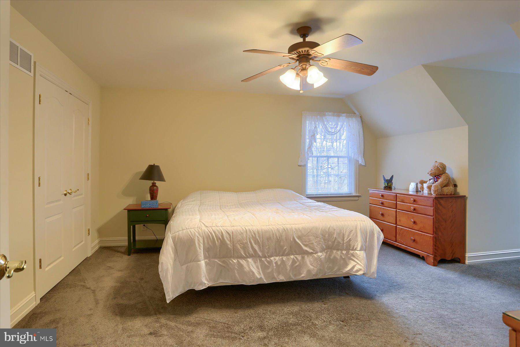 210 South Grantham Road Dillsburg, PA 17019 - Photo 36 of 56 a bedroom with a bed and a chandelier