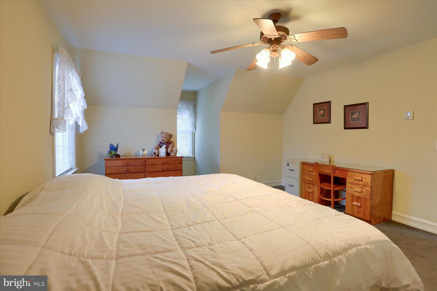 210 South Grantham Road Dillsburg, PA 17019 - Photo 37 of 56 a bedroom with a bed and a chandelier