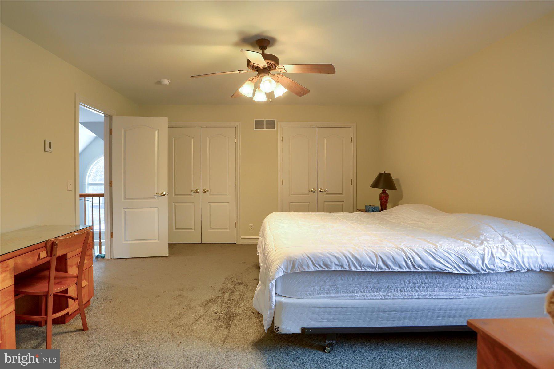 210 South Grantham Road Dillsburg, PA 17019 - Photo 38 of 56 a bedroom with a bed and a chandelier