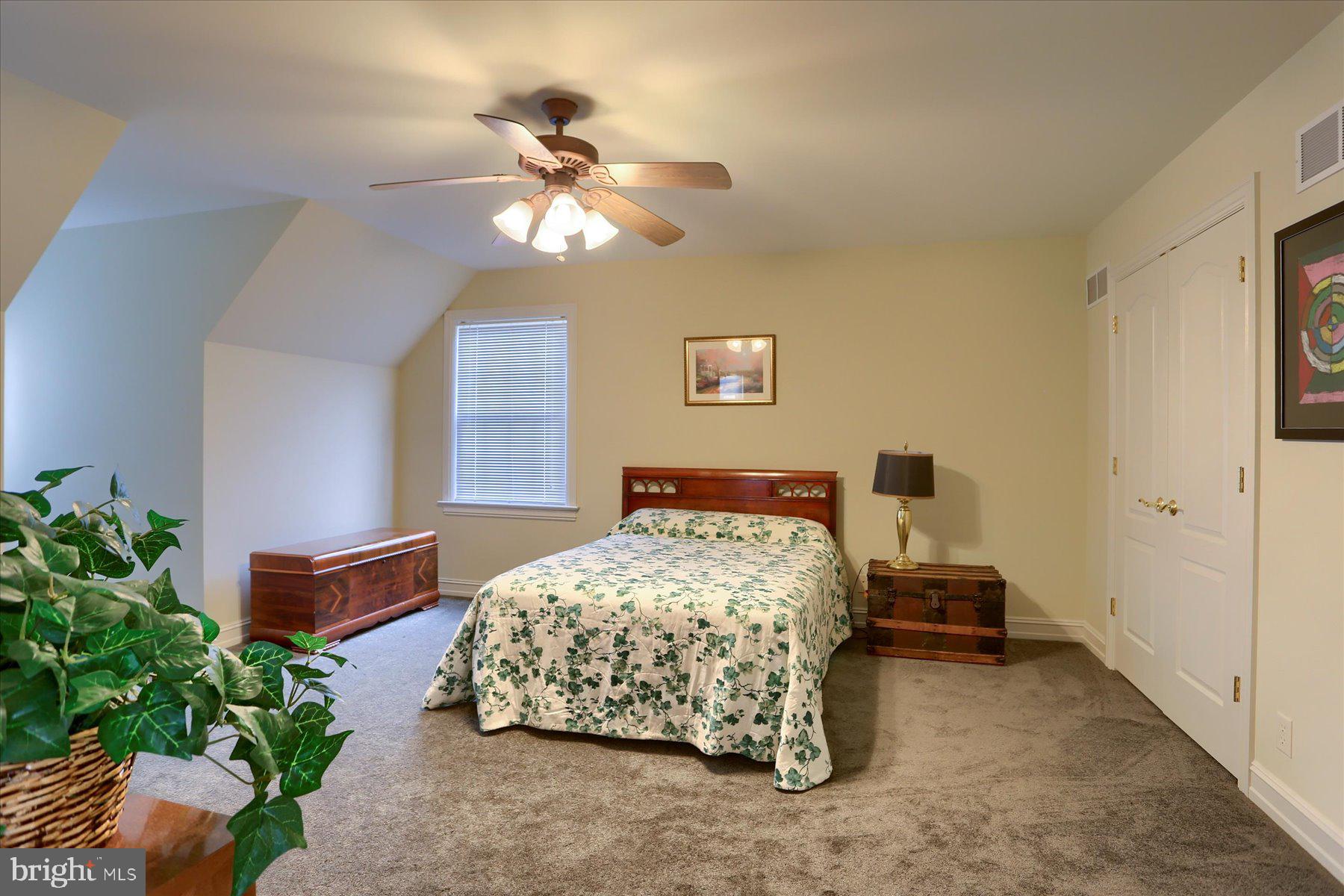 210 South Grantham Road Dillsburg, PA 17019 - Photo 40 of 56 a bedroom with a bed and a chandelier