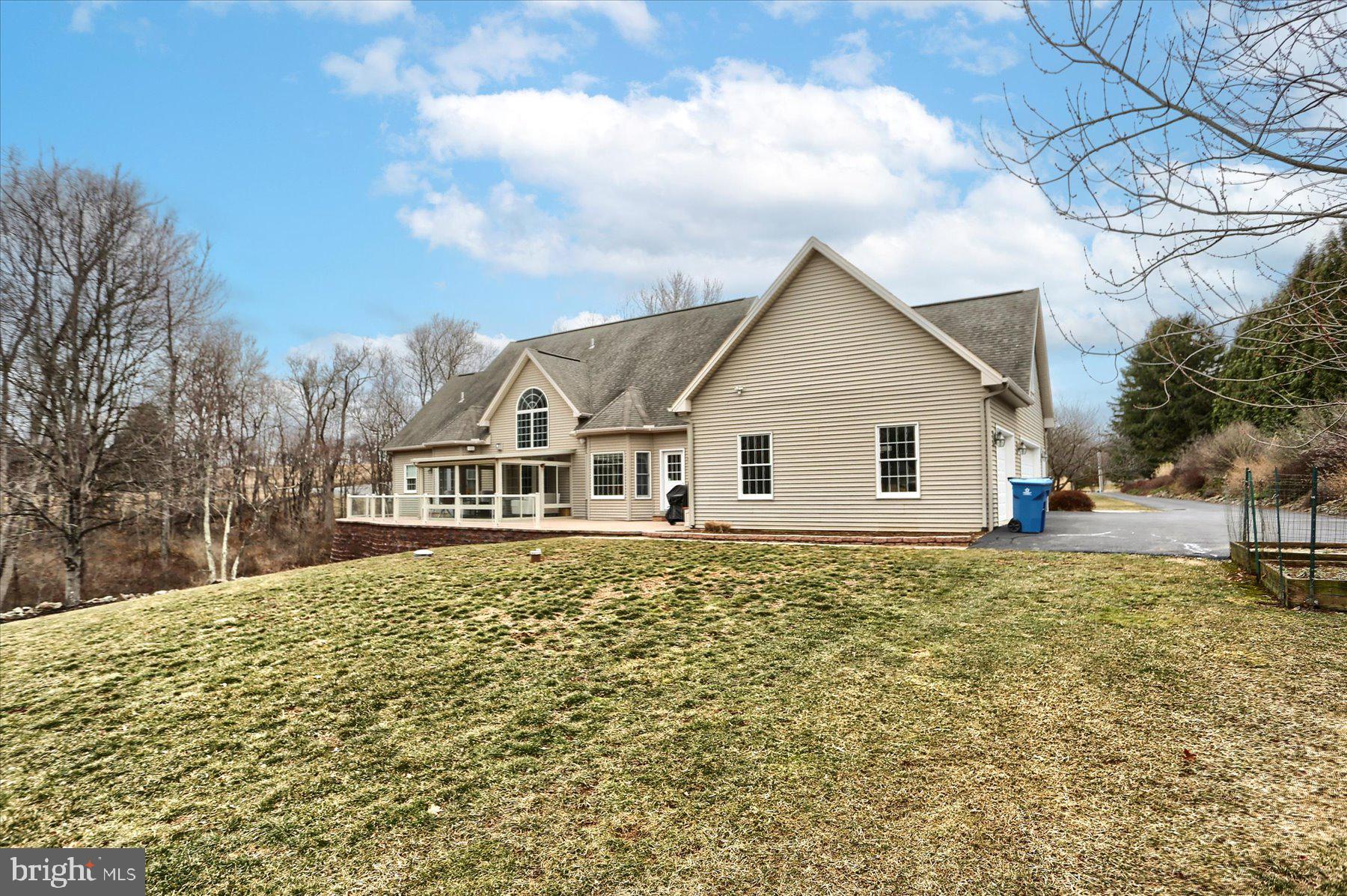 210 South Grantham Road Dillsburg, PA 17019 - Photo 50 of 56 a view of a house with a yard