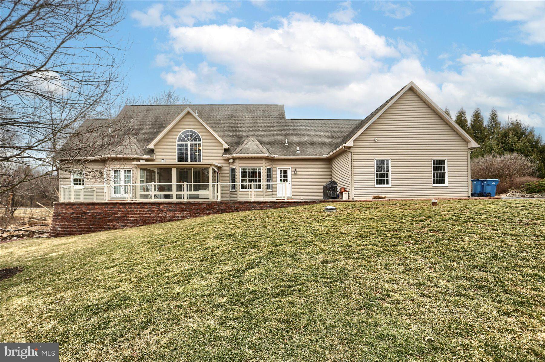 210 South Grantham Road Dillsburg, PA 17019 - Photo 51 of 56 a front view of a house with a garden