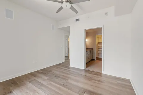 a view of a room with wooden floor