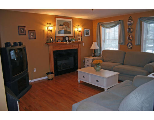 138 Gray Road Templeton, MA 01468 - Photo 18 of 29 a living room with furniture and a fireplace
