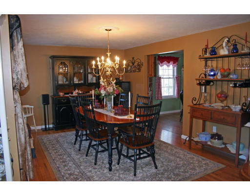138 Gray Road Templeton, MA 01468 - Photo 19 of 29 a view of a dining room with furniture and chandelier