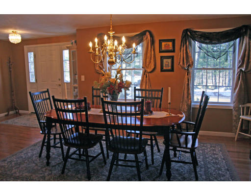138 Gray Road Templeton, MA 01468 - Photo 20 of 29 a view of a dining room with furniture a chandelier and wooden floor