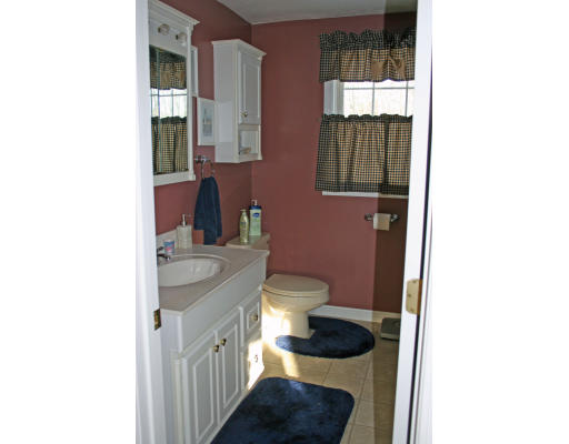 138 Gray Road Templeton, MA 01468 - Photo 23 of 29 a bathroom with a toilet a sink and mirror
