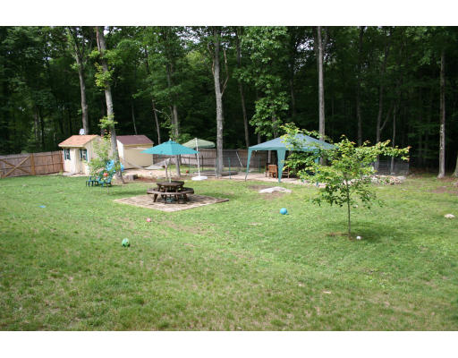 138 Gray Road Templeton, MA 01468 - Photo 9 of 29 a view of a chair and tables in the garden