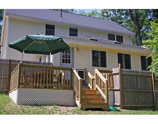 138 Gray Road Templeton, MA 01468 - Photo 10 of 29 a view of a white house with a yard and furniture